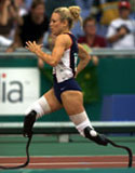 Shea Cowart of USA on her way to Gold in the Womens 100 m final in class 44 during the 2000 Paralympic Games.  Sean Garnsworthy/Allsport