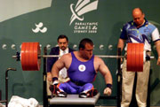 Nick Slater of Great Britain in action whilst winning bronze during the Powerlifting 100 kg division at the 2000 Paralympic Games.  Scott Barbour/Allsport