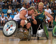 Stephen Pate of USA clashes with Brad Dubberley of Australia during the Mens Wheelchair Rugby Gold Medal Match during the 2000 Paralympic Games. USA won that match.  Scott Barbour/Allsport